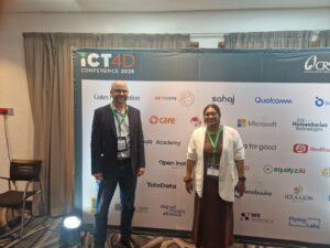 Yazeed Sheqem and Anupama Ramaswamy at the ICT4D 2026 sponsor board in Nairobi, featuring the TolaData logo