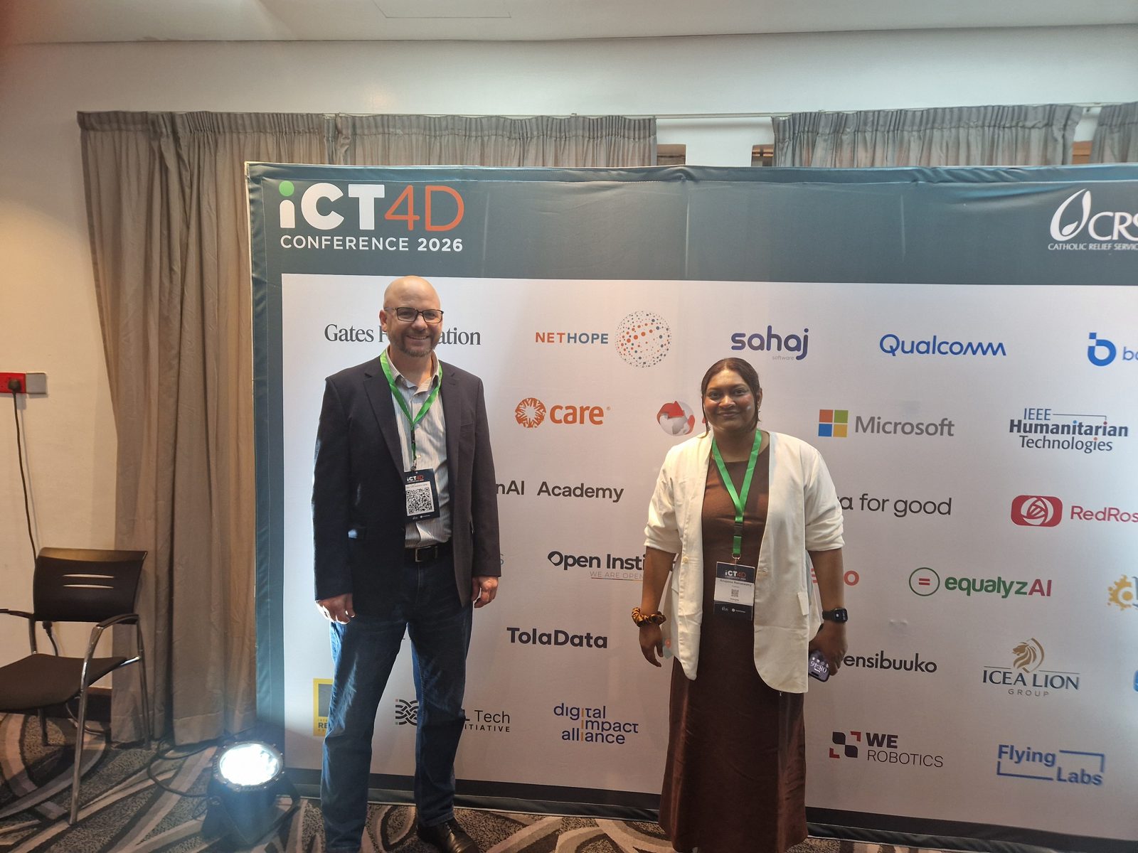 Yazeed Sheqem and Anupama Ramaswamy at the ICT4D 2026 sponsor board in Nairobi, featuring the TolaData logo